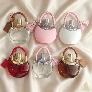 100ml Handbag Shape Liquid Perfume Bottle Empty Refillable Spray Bottle with Braided Handle Custom Logo Woody Scent